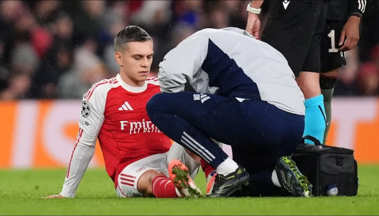 Arsenal's Leandro Trossard receives treatment for an injury 