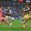 Aston Villa's Ian Maatsen scores his side's opening goal
