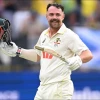 Australian batsman Travis Head reacts after scoring a century 
