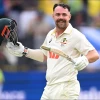 Australian batsman Travis Head reacts after scoring a century 