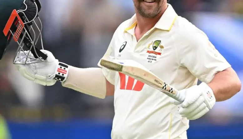 Australian batsman Travis Head reacts after scoring a century 