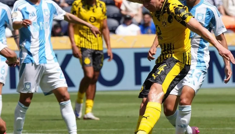 Borussia Dortmund's Daniel Svensson scores