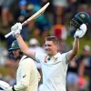 Australia's Cameron Green celebrates scoring 100 runs against New Zealand on the first day of their cricket test match in Wellington, New Zealand