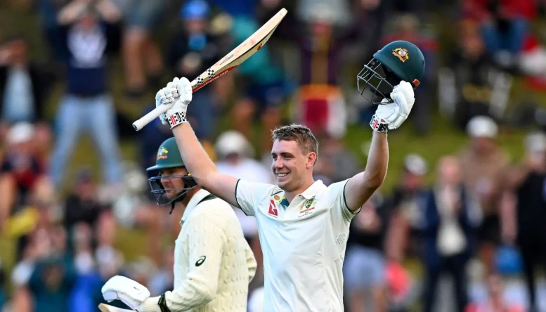 Australia's Cameron Green celebrates scoring 100 runs against New Zealand on the first day of their cricket test match in Wellington, New Zealand