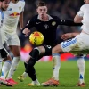 Chelsea's Cole Palmer battles for the ball with Leeds players 