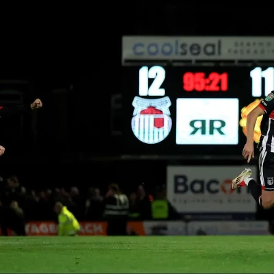 Grimsby Town’s players celebrate defeating Manchester United