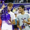 Jannik Sinner and Carlos Alcaraz pose with trophies