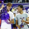 Jannik Sinner and Carlos Alcaraz pose with trophies