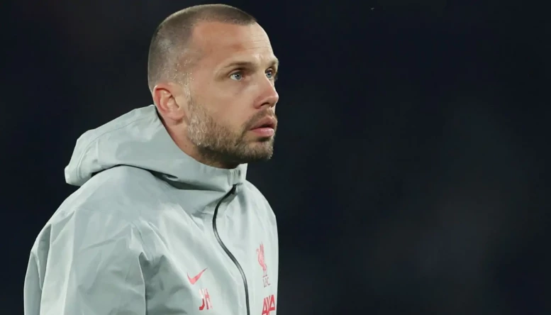 John Heitinga as Liverpool assistant manager.
