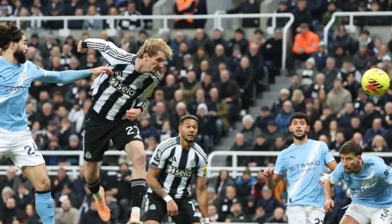 Nick Woltemade of Newcastle United heads the ball towards goal 