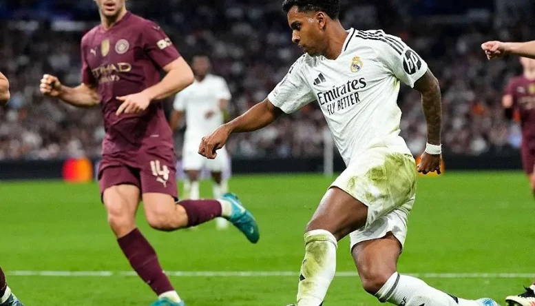 Rodrygo of Real Madrid controls the ball during the Champions League playoff