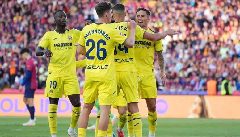 Tajon Buchanan celebrates his Villarreal winner with teammates