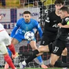 Tottenham's goalkeeper Guglielmo Vicario prepares to make a save