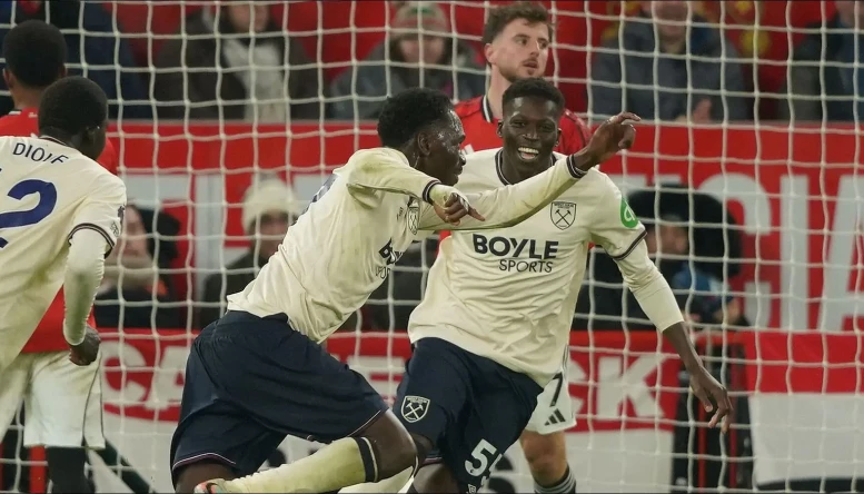 West Ham's Soungoutou Magassa, centre, celebrates after scoring